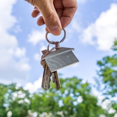 Real Estate agent holding house keys